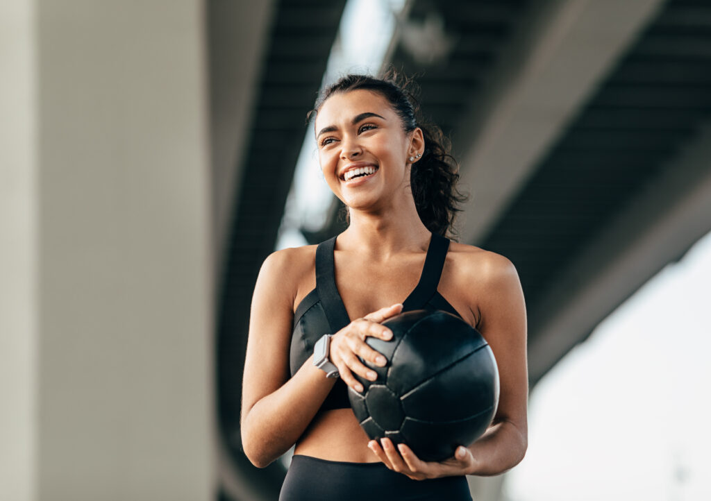 Confident trainer holding kettlebell after ISSA Fitness Certification India